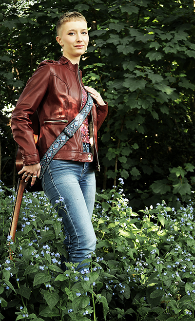 Zara posing for promotional pictures surrounded by Bluebells.