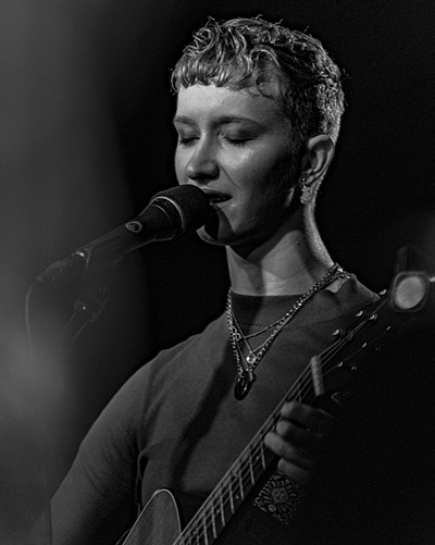Zara performing on stage at The Old Fire Station music venue, Bournemouth.